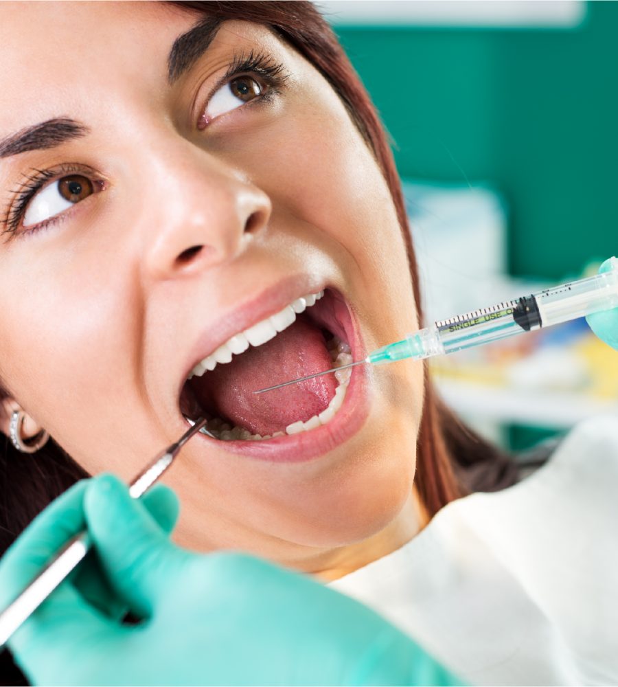 dentist-giving-anesthesia-patient-before-dental-surgery-selective-focus-focus-patient
